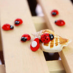 Coccinelles en bois de décoration